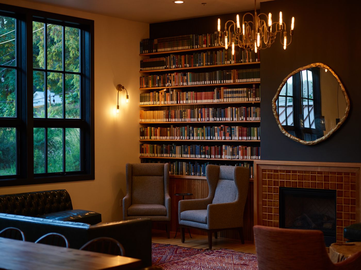 A private library, warm with books